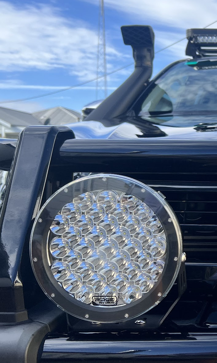 Ridge Ryder driving lights, a roof light bar and a snorkel fitted to a four wheel drive